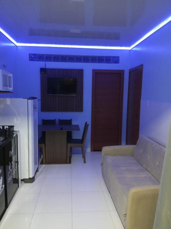 a living room with a couch and a table at APART HOTEL Wm in Belém