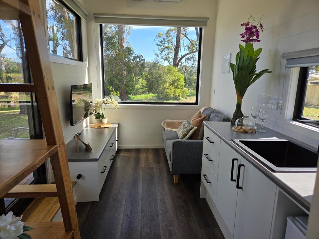 a kitchen and living room in a tiny house at BIG4 Sale Caravan Park in Sale