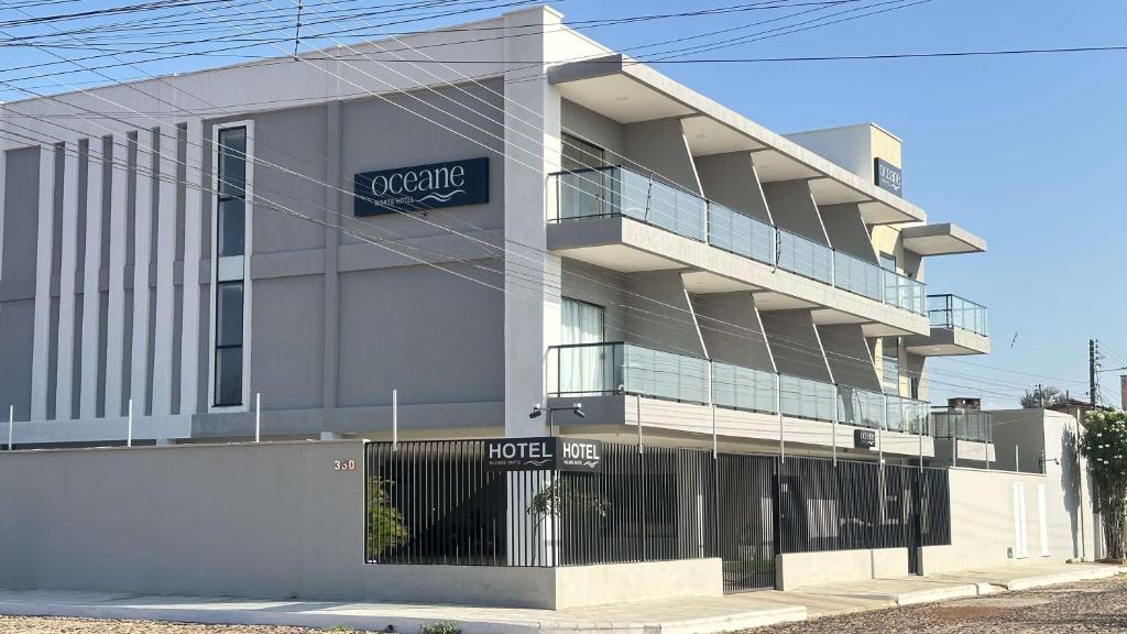 a building with a sign on the side of it at Oceane Norte Hotel in Parnaíba