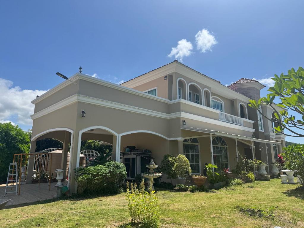 a large house with a large front yard at Paiyawadee House khaoyai in Ban Hua Phrong