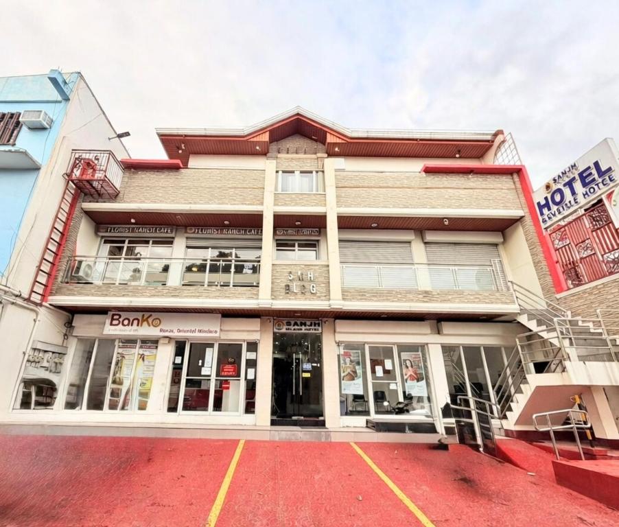 a store front of a building on a street at SANJH Island Hotel powered by Cocotel in Roxas