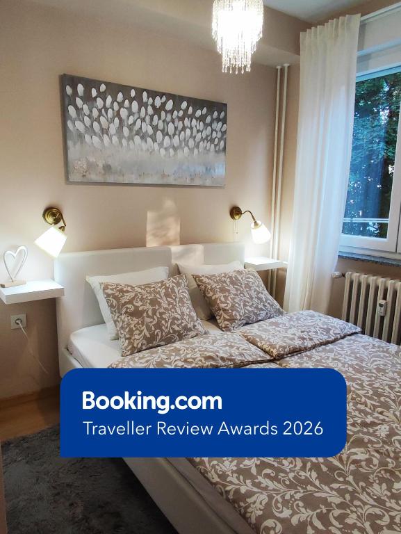 a bedroom with a bed and a chandelier at Apartman TEO, self check-in, free parking in Slavonski Brod