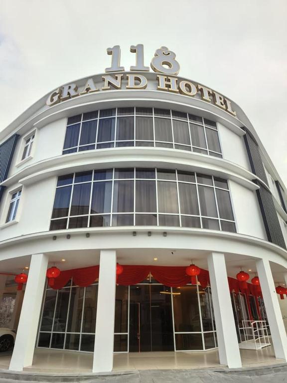 a building with a sign on top of it at 118 Grand Hotel in George Town