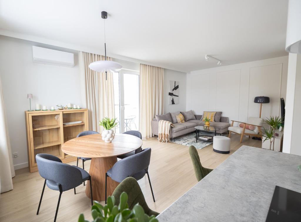 a living room with a table and a couch at Apartament D&Z in Elblag