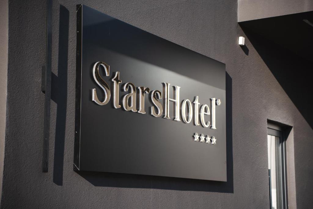 a sign on the side of a building at Stars Hotel in Jelah