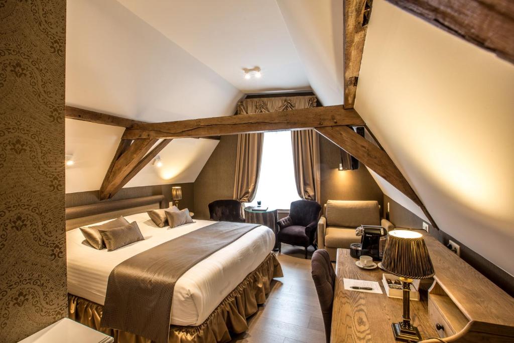 Postel nebo postele na pokoji v ubytování Boutique Hotel De Castillion