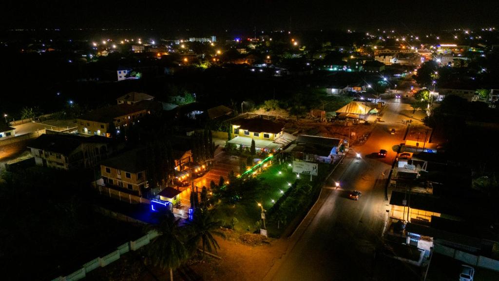 an aerial view of a city at night at Eastern Plus Hotel in Somanya