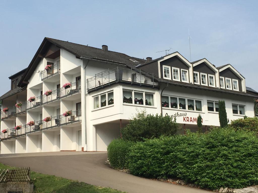 a large white building with windows and balconies at Landhaus Kramer in Willingen