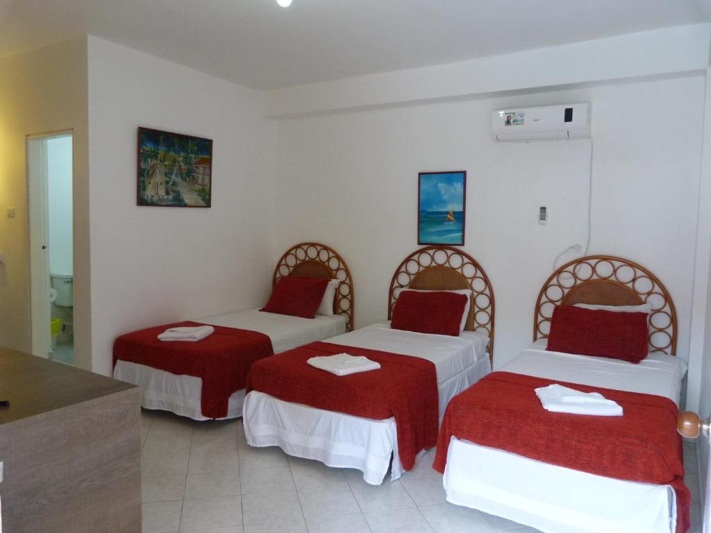 Postel nebo postele na pokoji v ubytování Sunset Hotel