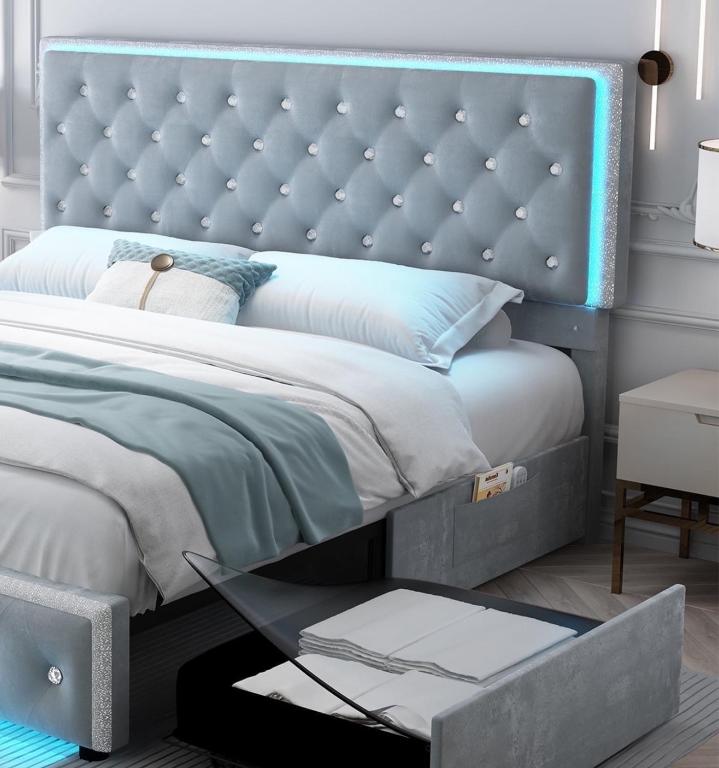 a bedroom with a large bed with a blue headboard at Your private room CozyVibe in Edmonton