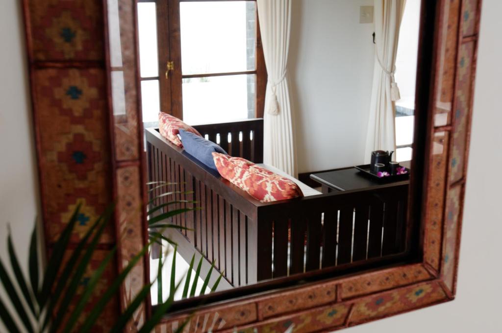 a mirror with pillows on a balcony with a window at Resort Hotel Corte Largo Izu Kogen in Ito