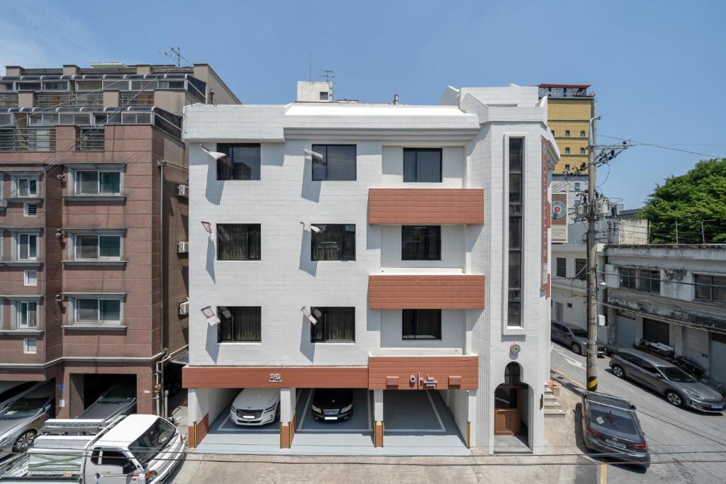 an apartment building with a balcony in a city at Anook Hotel Daejeon Daeheung in Daejeon