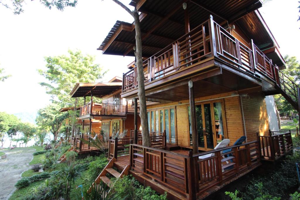 a large wooden house with decks on a hill at Longbay Lipe in Ko Lipe