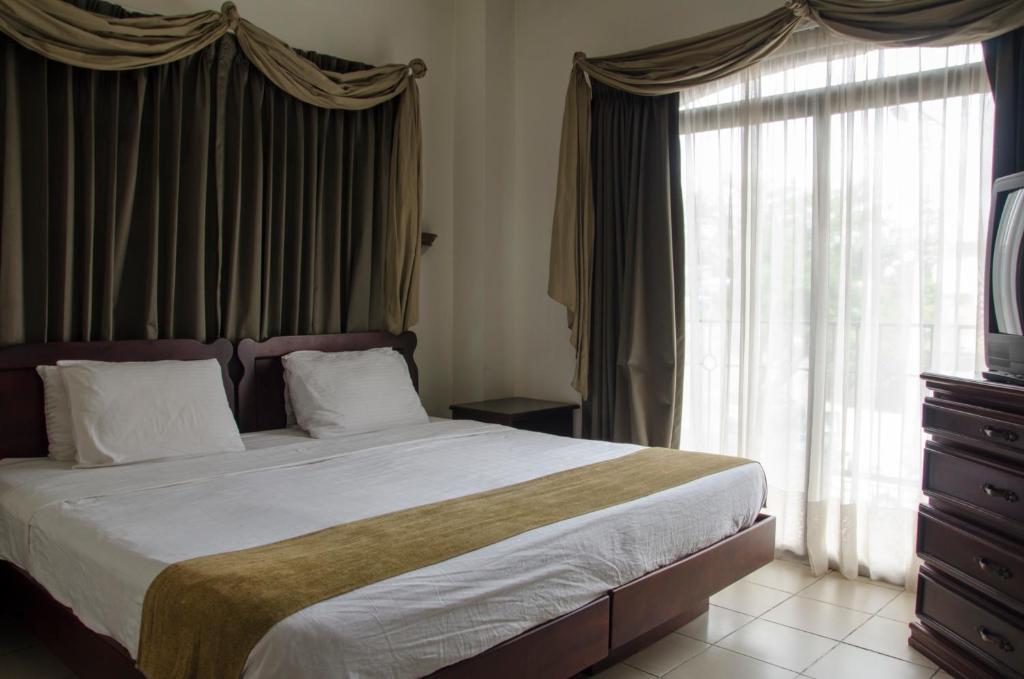 Postel nebo postele na pokoji v ubytování Hotel Plaza Real Suites & Apartments San Jose