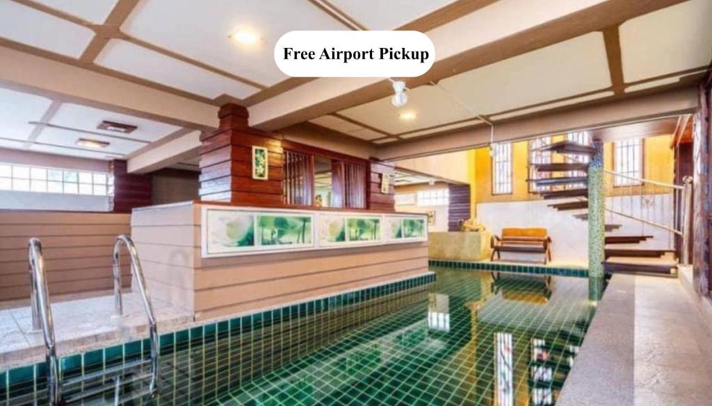 a house with a swimming pool in a house at The Phuket Pool Villa in Phuket