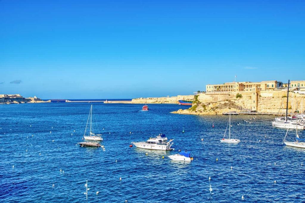 a group of boats in a large body of water at Studio in Historic Birgu in Birgu