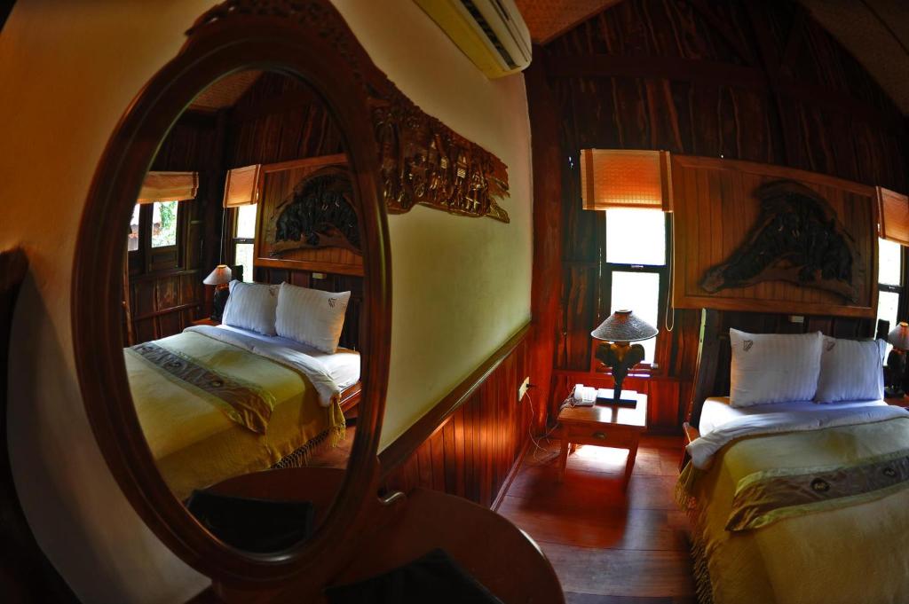 Postel nebo postele na pokoji v ubytování Chuanthanapanya Resort