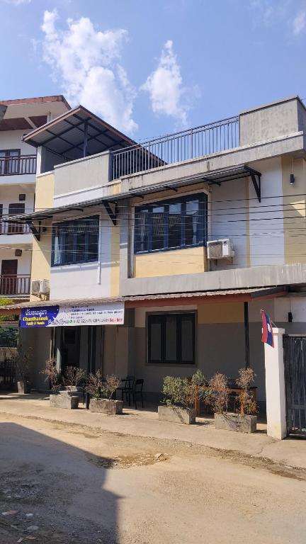 a building on the side of a street at ChanthaSouk Vang Vieng Entire Villa in Vang Vieng