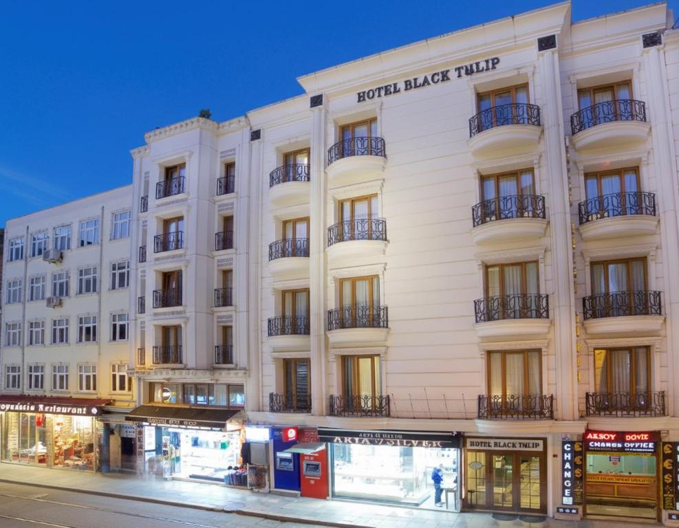 a white building on the corner of a street at Hotel Black Tulip in Istanbul