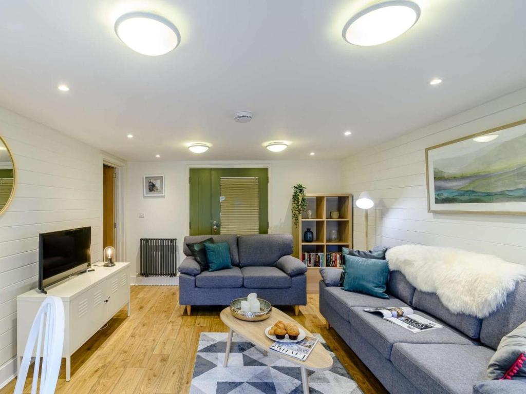 a living room with two couches and a tv at 2 Bed in Scarborough oc-82543 in Snainton