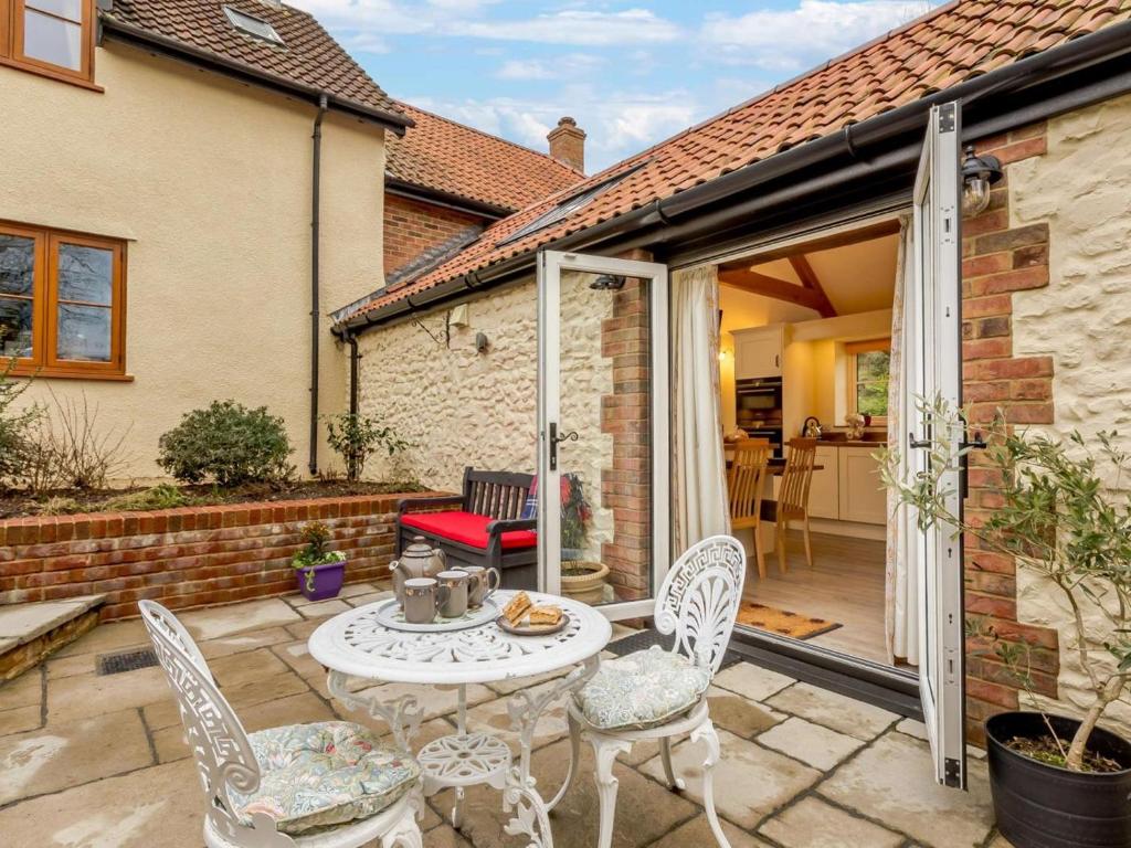 a patio with a table and chairs in a house at 1 Bed in Chard oc-91135 in Cudworth
