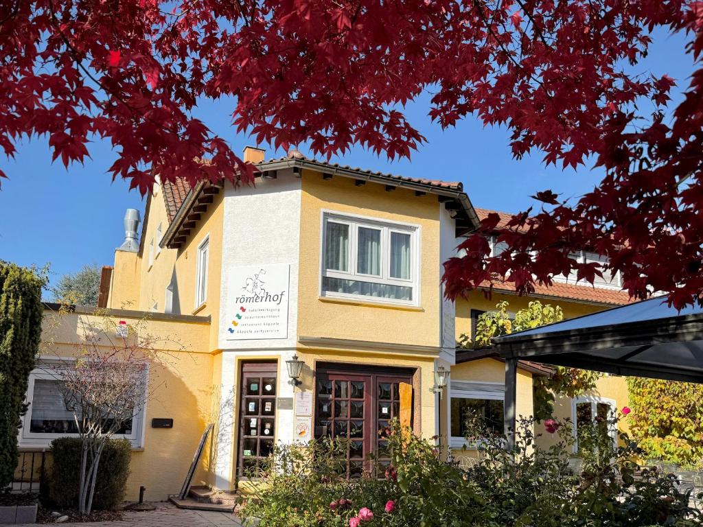 a yellow house with red leaves at Römerhof in Stuttgart