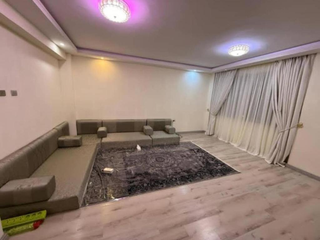 a living room with a couch and a table at HD Residential Apartment , Bole Dembel in Addis Ababa