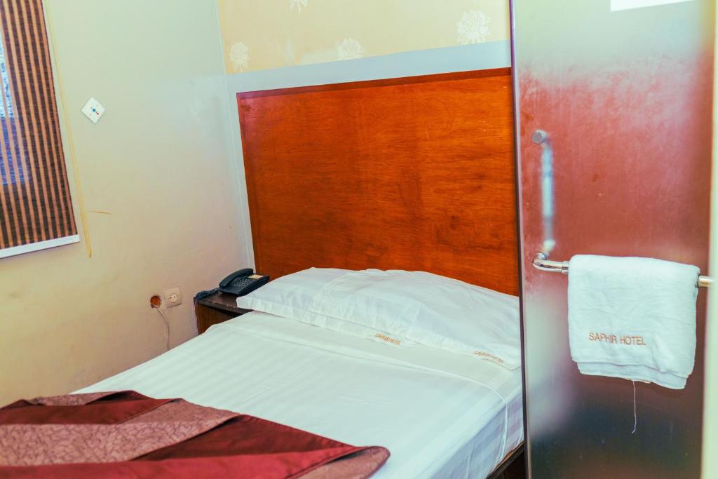 Llit o llits en una habitació de Saphir hotel