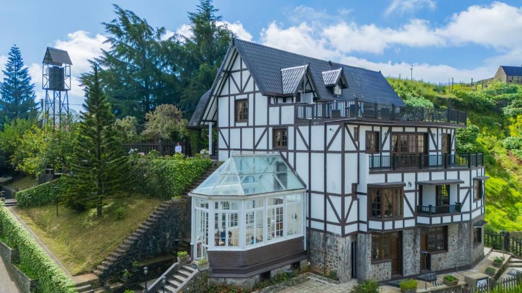 an aerial view of a house with a greenhouse at Ard Lui Residence in Nuwara Eliya