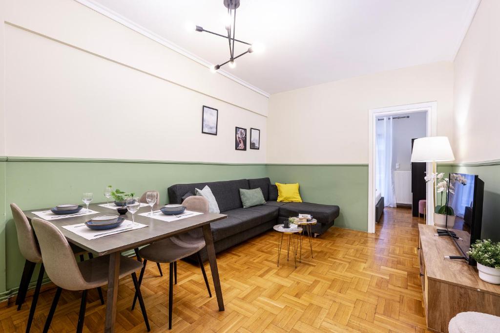 a living room with a couch and a table at Houseloft CityView Hagia Sophia in Thessaloniki