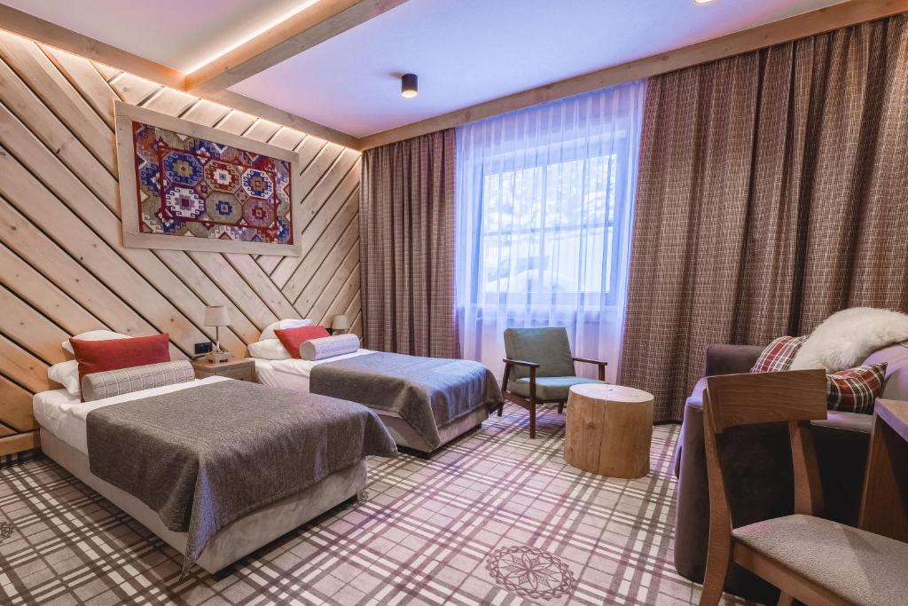 เตียงในห้องที่ Hotel Jaworzyna Krynicka