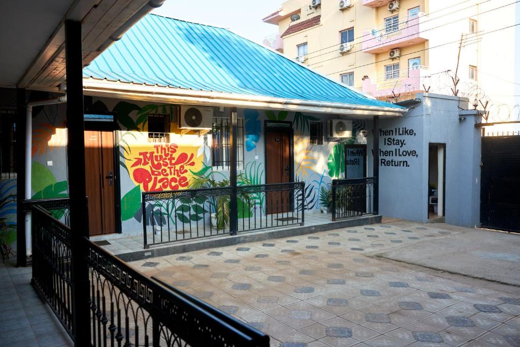 a building with a sign on the side of it at Oasis Guesthouse Juba in Juba