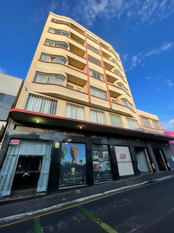 a tall building with windows on the side of it at Hotel Ponta Grossa São Marcos in Ponta Grossa