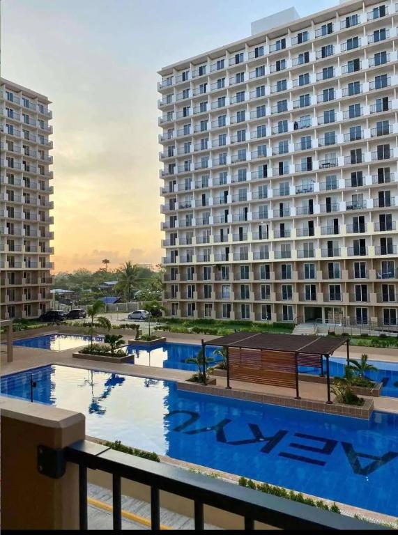 a large apartment building with a large swimming pool at Saekyung 301-1603 in Concepcion