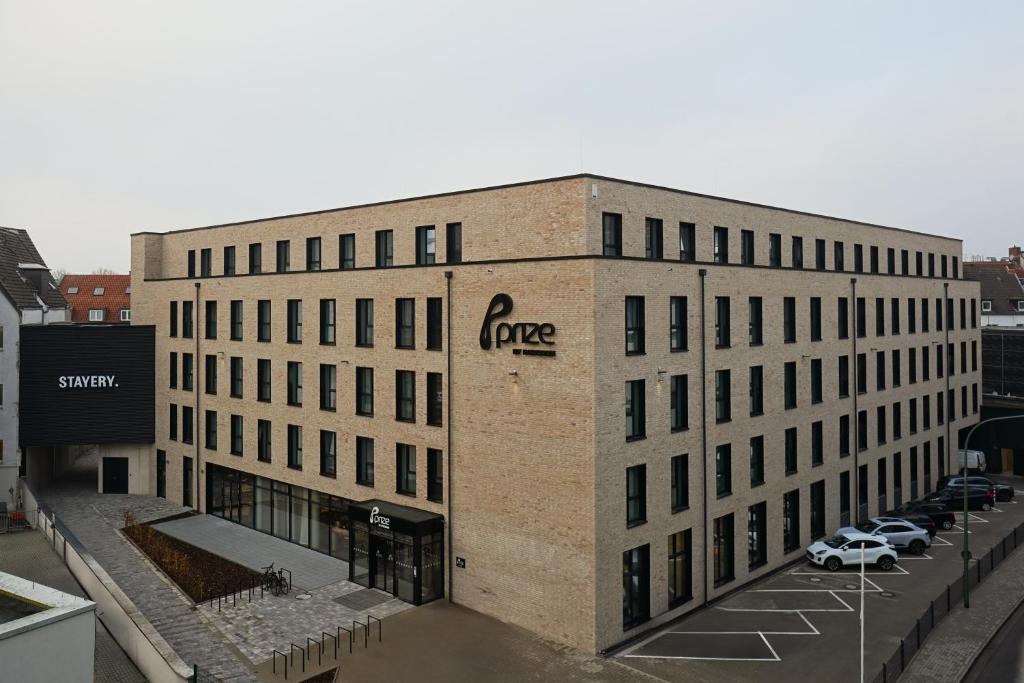 a large brick building with the word gore on it at Prize by Radisson, Osnabruck in Osnabrück
