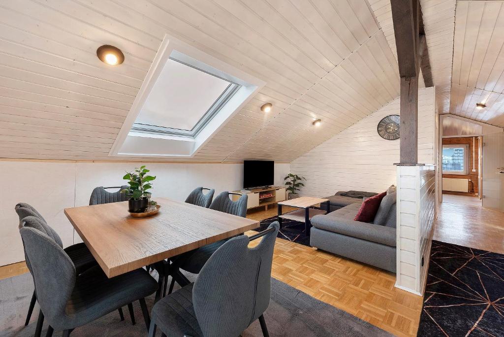 a dining room with a table and a couch at Ferienwohnung Witt in Salem