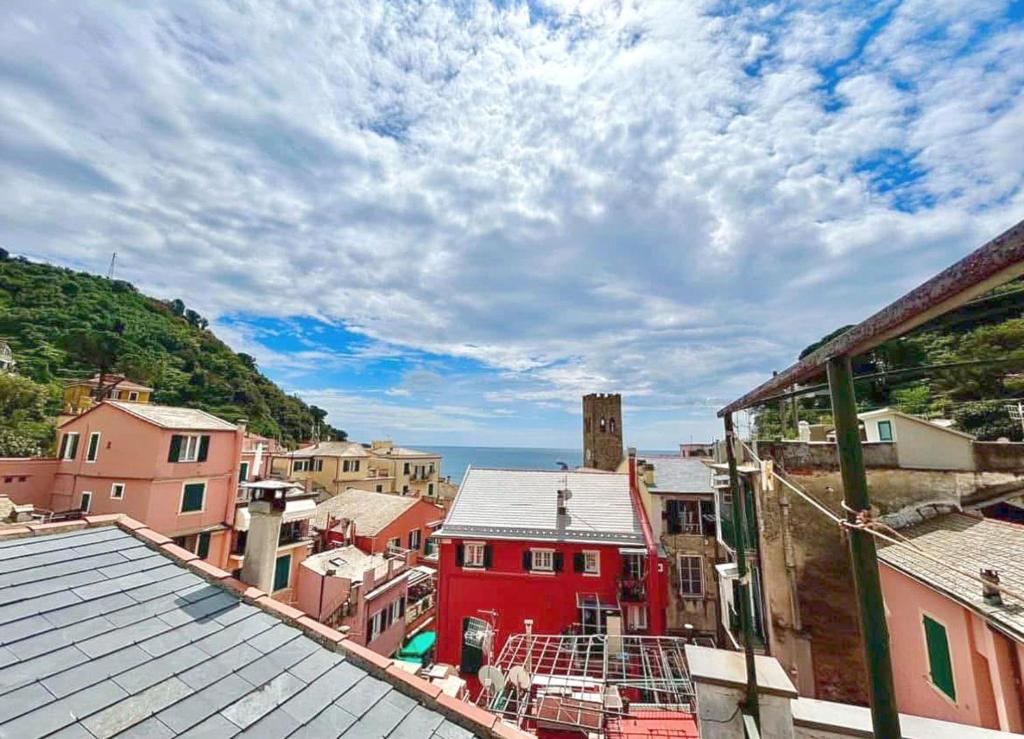 a view of a city with a red building at Good Vibes Apartment in Monterosso al Mare
