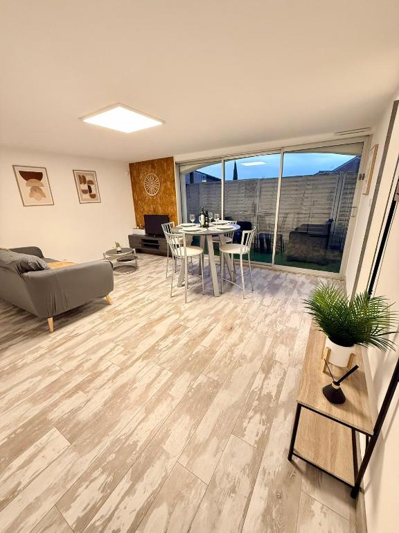a living room with a couch and a table at Chez Niko in Martigues