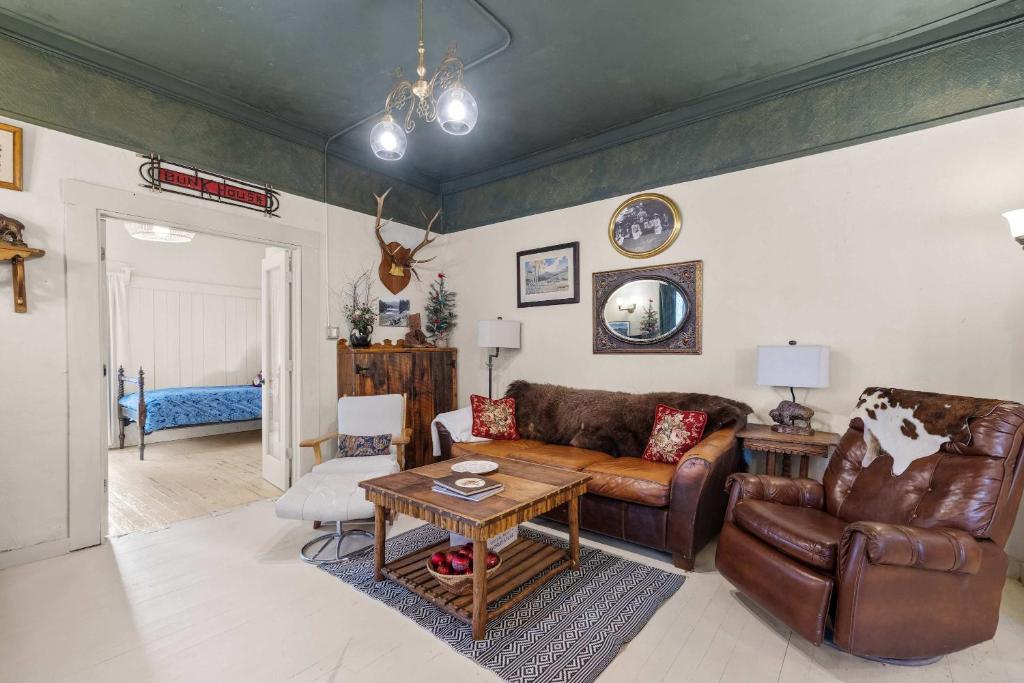a living room with a couch and a table at Camp Red Lodge - Cozy & Convenient in Red Lodge