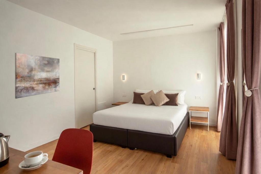 Giường trong phòng chung tại Hotel Ciao