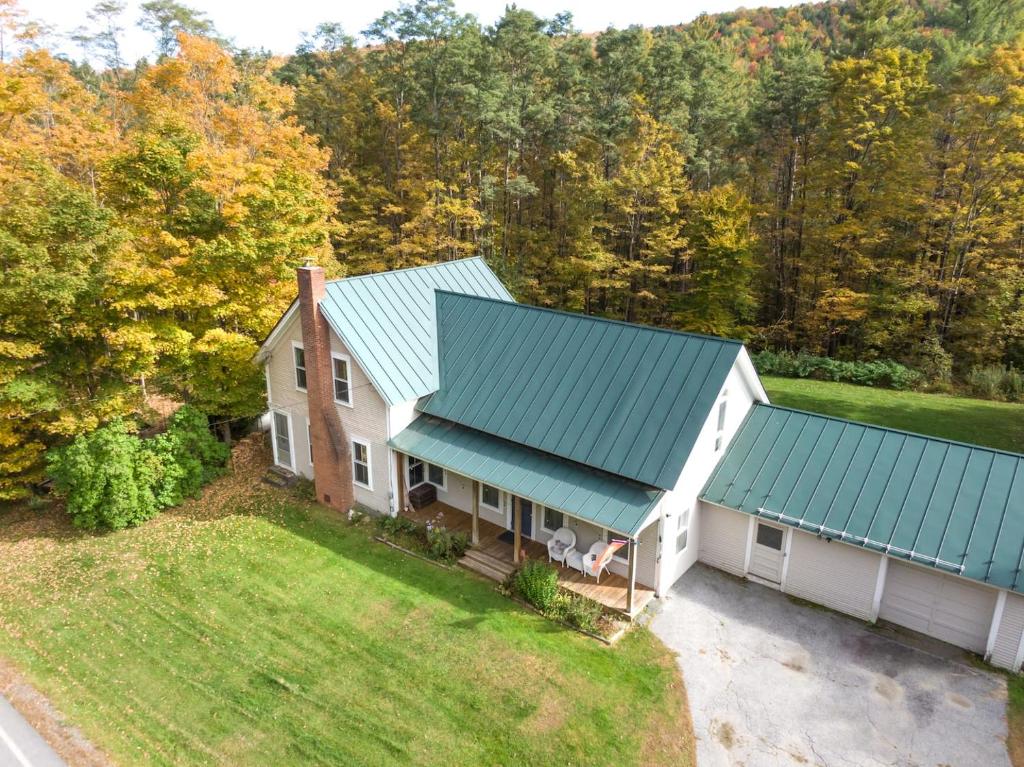 an aerial view of a house with a blue roof at Vermont Escape, Too in Warren