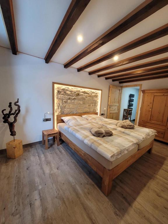 a bedroom with a large bed in a room at Ah Helledahls in Weyer