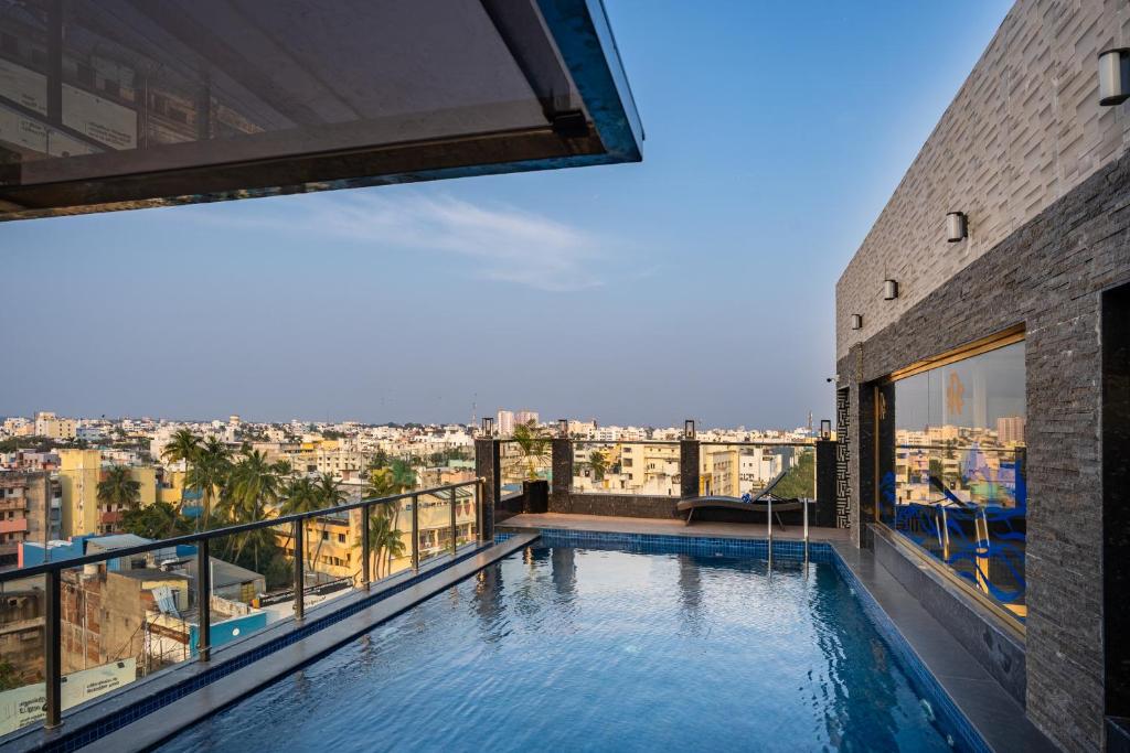 a swimming pool on top of a building at Ratan International in Pondicherry