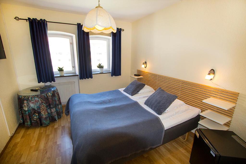 Postel nebo postele na pokoji v ubytování Hotel Chaplin