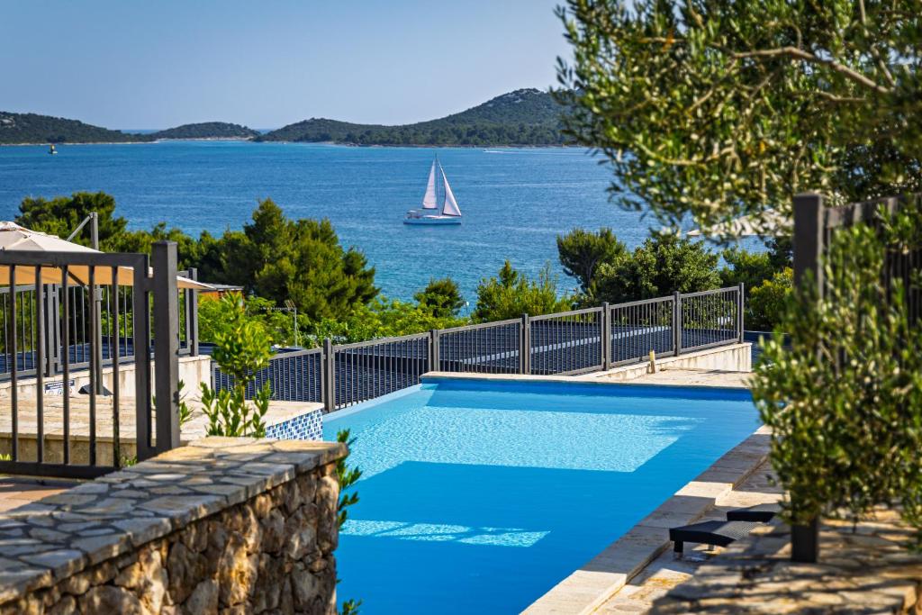 a swimming pool with a view of the water at Camp Panorama Plus with Pool in Drage