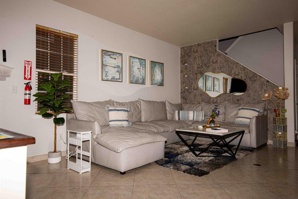 a living room with a couch and a table at InHomeStays in Lakewood