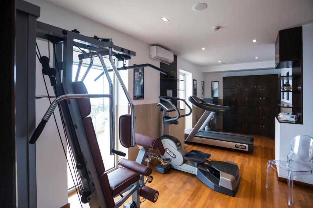 a room with a gym with a cardio machine at Hotel Cetus in Cetara