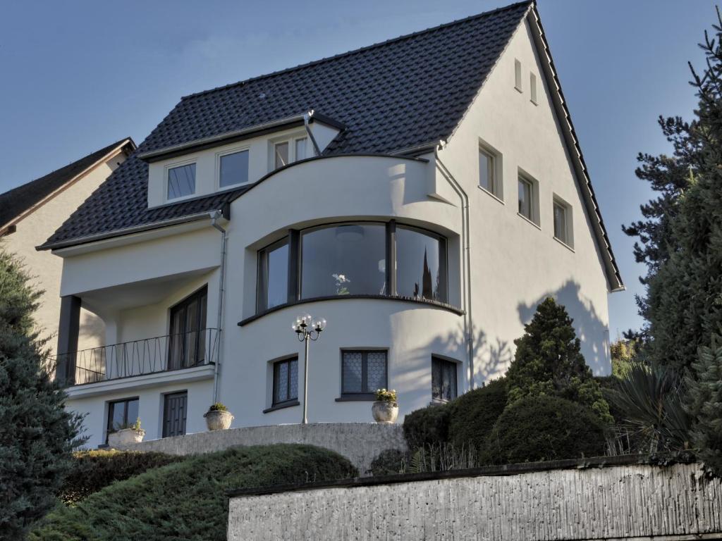 a white house with a black roof at Rheinvilla Weitblick in Boppard