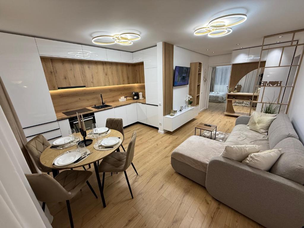 a living room with a couch and a table at Luxury Residence in Baia Mare