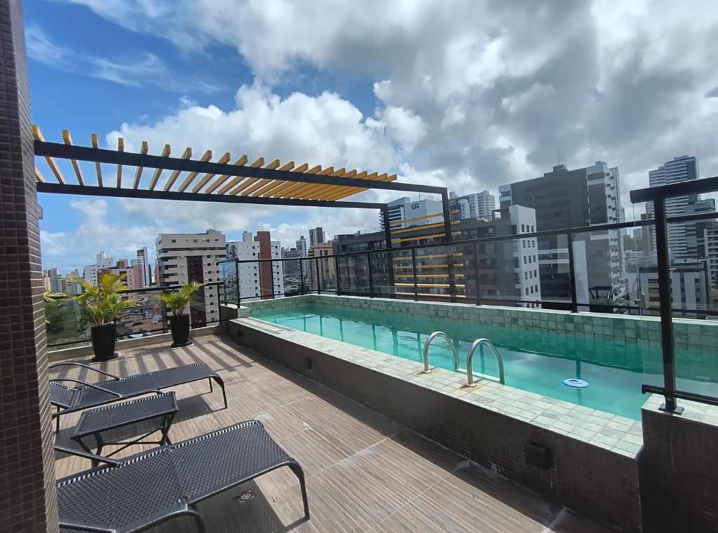 a swimming pool on the roof of a building at Flat PREMIUM em Manaíra - Sun Beach in João Pessoa